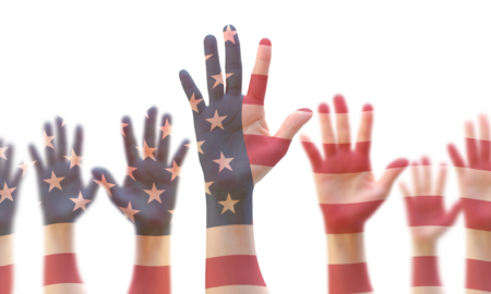 Conflic resolution, youth leadership and civic engagement grants: raised hands of young people colored like american flag