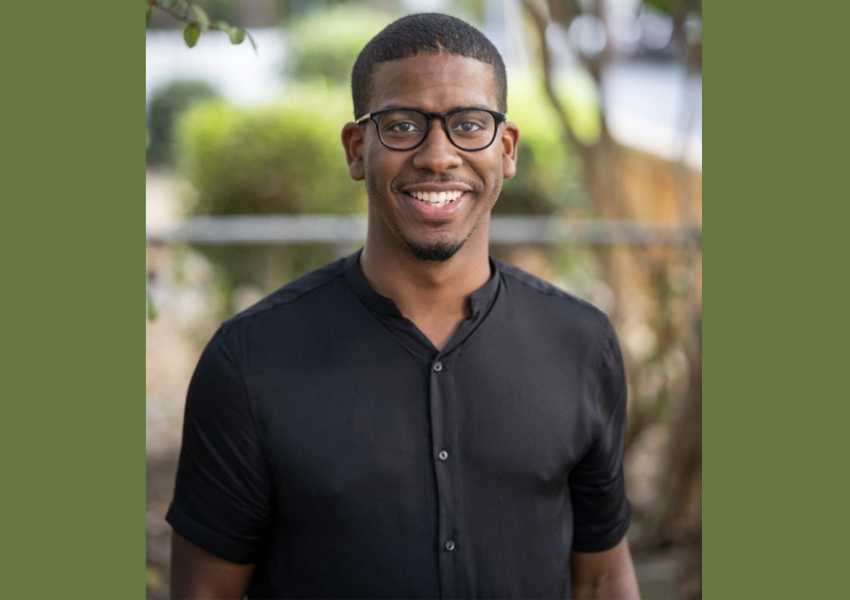 Child welfare advocacy: A man with glasses wearing a black shirt