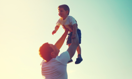 A future for the world's children report; father holding child in the air